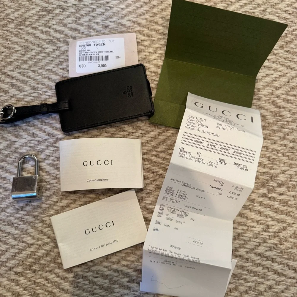 New! Gucci GG embossed black leather duffel bag